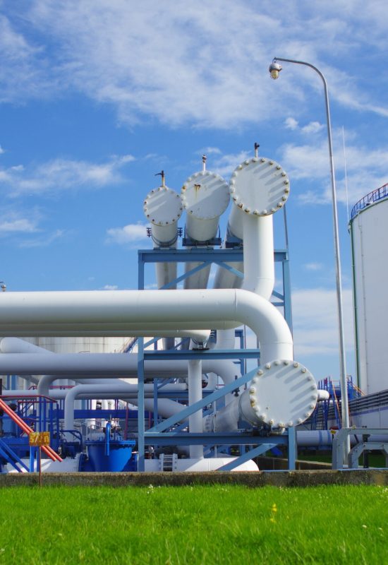 Industrial processing facility with extensive piping, ladders, and equipment requiring integrated field instrumentation and controls.